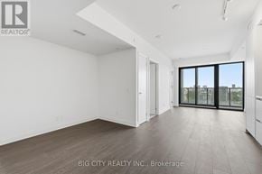 Toronto (Thorncliffe Park) condo for rent - A spacious room with a sliding glass door leading to a balcony.