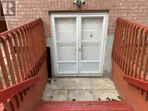 Toronto (West Hill) apartment for rent - A white double door is flanked by red railings.