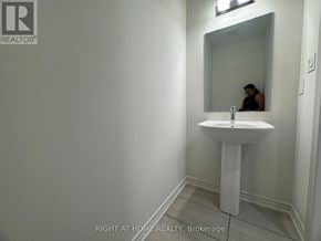 Kawartha Lakes (Lindsay) multi-family for rent - A bathroom with a sink and mirror.