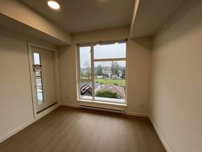 Surrey apartment for rent - A room with a large window overlooking a residential area.