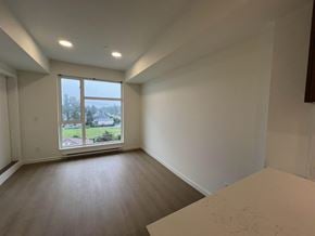 Surrey apartment for rent - A room with a large window and wooden flooring.