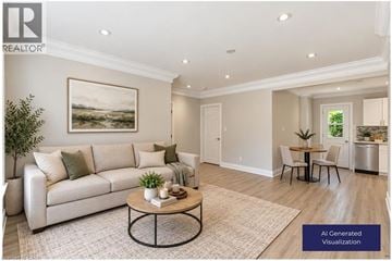 Hamilton townhouse for rent - A living room with a couch, a coffee table, and a painting on the wall.