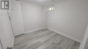 Brampton (Bram West) apartment for rent - A room with wooden flooring and white walls.