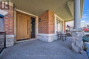 Brampton (Bram East) apartment for rent - A house entrance with a wooden door and a glass window.