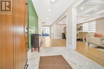 Brampton (Bram East) apartment for rent - A living room with a brown rug and a green accent wall.