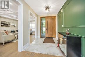 Brampton (Bram East) apartment for rent - A hallway with a green wall and a wooden door.