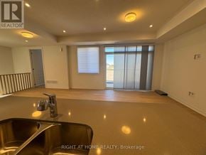 Kawartha Lakes (Lindsay) multi-family for rent - A spacious room with a sink and a window with blinds.