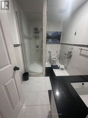 Pickering (Highbush) apartment for rent - A bathroom with a toilet, sink, and shower.