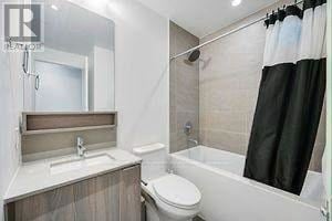 Vaughan (Vaughan Corporate Centre) condo for rent - A bathroom with a toilet, sink, and bathtub.