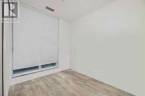 Vaughan (Vaughan Corporate Centre) condo for rent - A room with a window and wooden flooring.