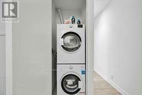 Vaughan (Vaughan Corporate Centre) condo for rent - A white washing machine and dryer in a small room.
