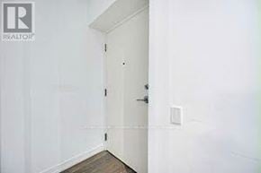Vaughan (Vaughan Corporate Centre) condo for rent - A white door is in a white room.