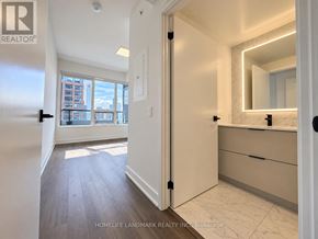 Toronto (North St. James Town) condo for rent - A bathroom with a mirror and a sink.
