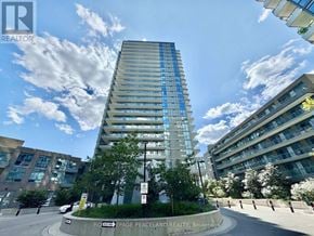 Toronto (Henry Farm) condo for rent - A tall building with a blue sky and clouds in the background.