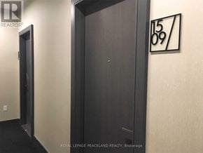 Toronto (Henry Farm) condo for rent - A black door with a number 1509 on the wall above it.