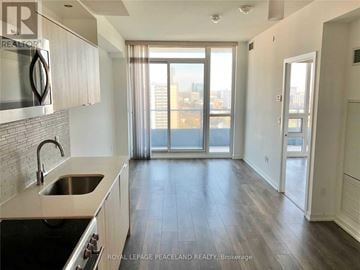 Toronto (Henry Farm) condo for rent - A kitchen with a stove top oven and a sink.