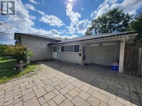 Markham (Bullock) apartment for rent - A house with a garage and a driveway in front of it.