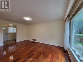 Markham (Bullock) apartment for rent - A room with wooden flooring and a window with white curtains.