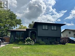 Welland (N. Welland) apartment for rent - A house with a grey facade and a large front yard.
