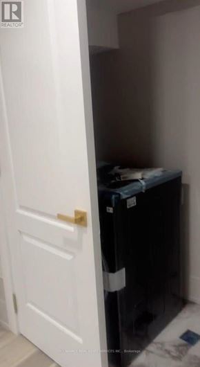 Vaughan (Kleinburg) apartment for rent - A white door is open to a small dark room.