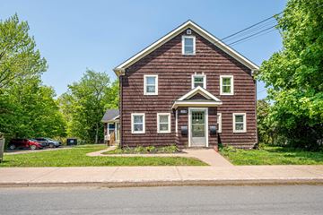 New Glasgow apartment for rent - A red brick house with a white door and windows.