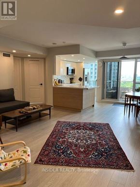 Toronto (Bayview Village) condo for rent - A living room with a rug on the floor and a couch.