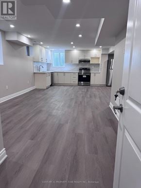 Caledon apartment for rent - A well-lit kitchen with grey flooring and white walls.