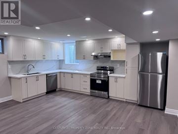 Caledon apartment for rent - A kitchen with white cabinets and stainless steel appliances.