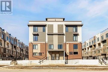 Mississauga (Erin Mills) townhouse for rent - A modern apartment building with the number 3413 on the front.