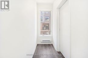 Mississauga (Erin Mills) townhouse for rent - A room with a window showing a building outside.