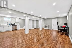 Hamilton (Hampton Heights) apartment for rent - A spacious kitchen and living room with wooden flooring and white walls.