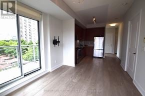 Toronto (Mount Pleasant West) condo for rent - A spacious living room with a view of the city.