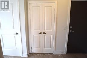 Toronto (Mount Pleasant West) condo for rent - A white door with a handle is in the middle of a room.
