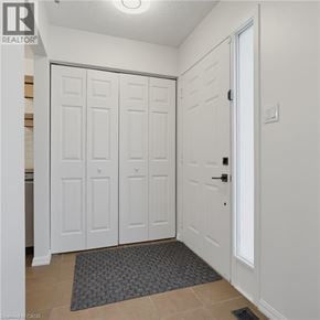 London apartment for rent - A white door with a black handle is closed.