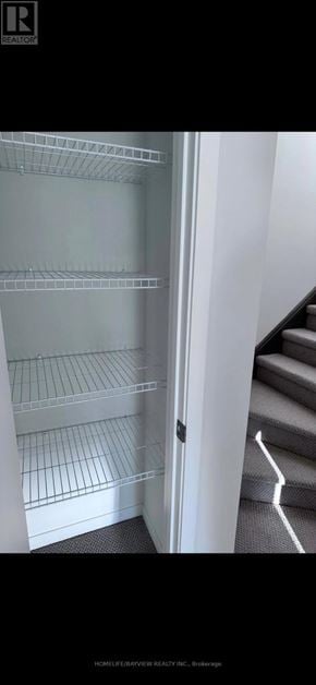 Vaughan (Vaughan Corporate Centre) townhouse for rent - A white refrigerator with its door open in a room.