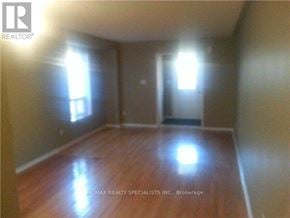 Brampton (Northwest Sandalwood Parkway) apartment for rent - A room with wooden floors and two windows.