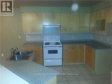 Brampton (Northwest Sandalwood Parkway) apartment for rent - A kitchen with a stove, sink and cabinets.