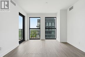Toronto (Thorncliffe Park) condo for rent - A spacious room with a view of a building outside the window.