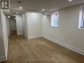 Brampton (Fletcher's West) apartment for rent - A room with wooden flooring and white walls, with a window on the right wall.