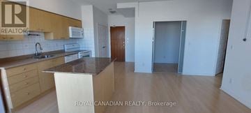 Brampton (Queen Street Corridor) condo for rent - A kitchen with a counter top and cabinets.