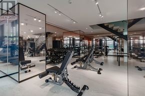 Toronto (Mount Pleasant West) condo for rent - A gym with a mirrored wall and various exercise equipment.