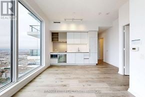 Vaughan (Vaughan Corporate Centre) condo for rent - A modern kitchen with a view of the city.