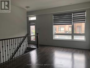 Vaughan (Vaughan Grove) townhouse for rent - A room with a staircase and a window with blinds.