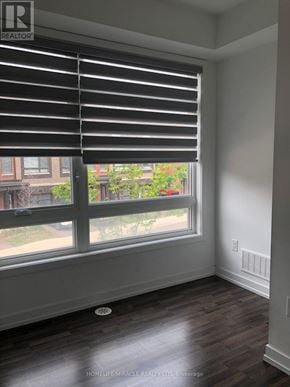 Vaughan (Vaughan Grove) townhouse for rent - A room with a window covered by black blinds.