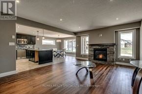 Woodstock (Woodstock - North) apartment for rent - A spacious living room with a fireplace and a dining area.