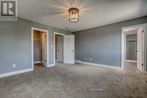 Woodstock (Woodstock - North) apartment for rent - A room with a grey wall and a light fixture on the ceiling.