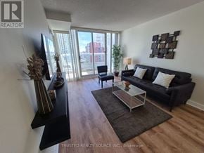 Toronto (Yonge-Eglinton) condo for rent - A bedroom with a bed, nightstands, and a window.