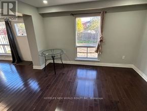 Toronto (Agincourt North) apartment for rent - A room with a glass table and a window with a view of a fence.