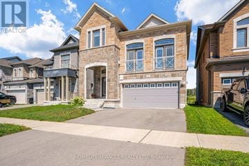 New Tecumseth (Alliston) apartment for rent - A large, two-story house with a garage is for sale.