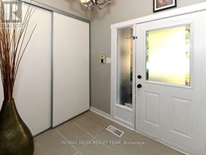 Ottawa townhouse for rent - A white door with a glass panel is open to a bright room.
